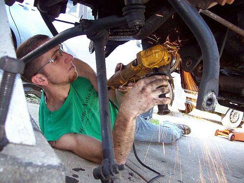 grind the rivet heads holding the passenger side beam bracket down flush with them bracket