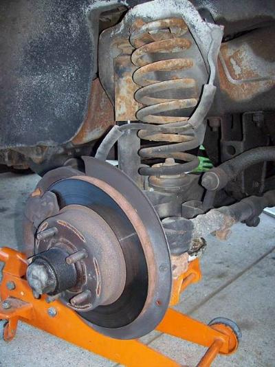 Remove the tires from the driver and passenger side of the front.