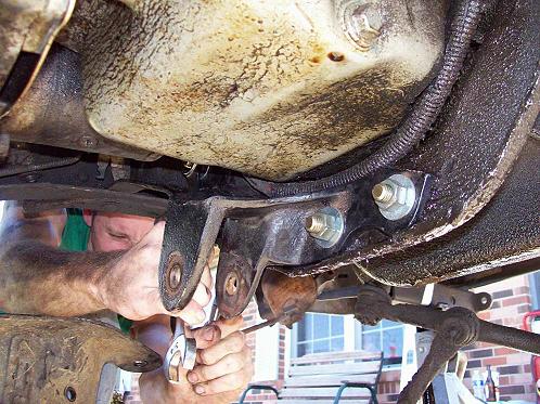 Mount the 4wd passenger side beam bracket