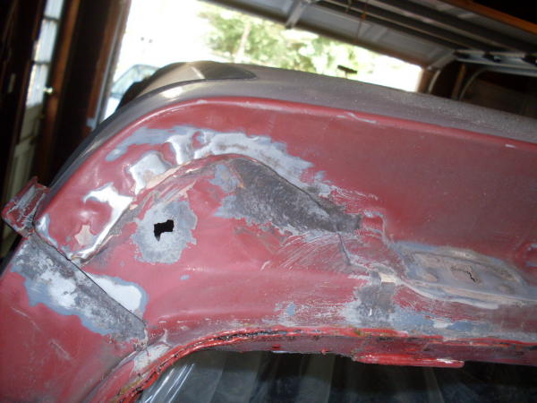 Rust hole under rear hatch