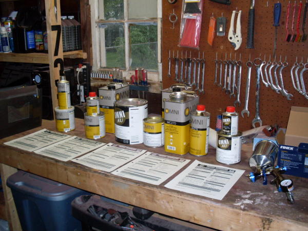 epoxy primer, high-build primer, red base coat, tan base coat, clear coat, single stage black