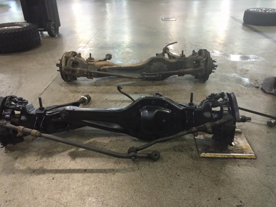The old Dana 28 front axle is at the top, and the Dana 35 replacement is sown at the bottom - forefront