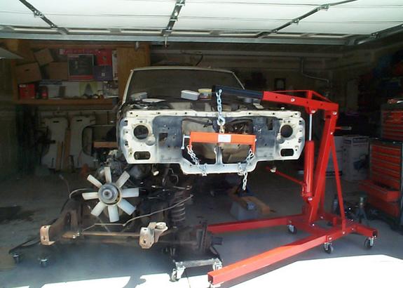 Moving Ford Bronco II body with shop crane